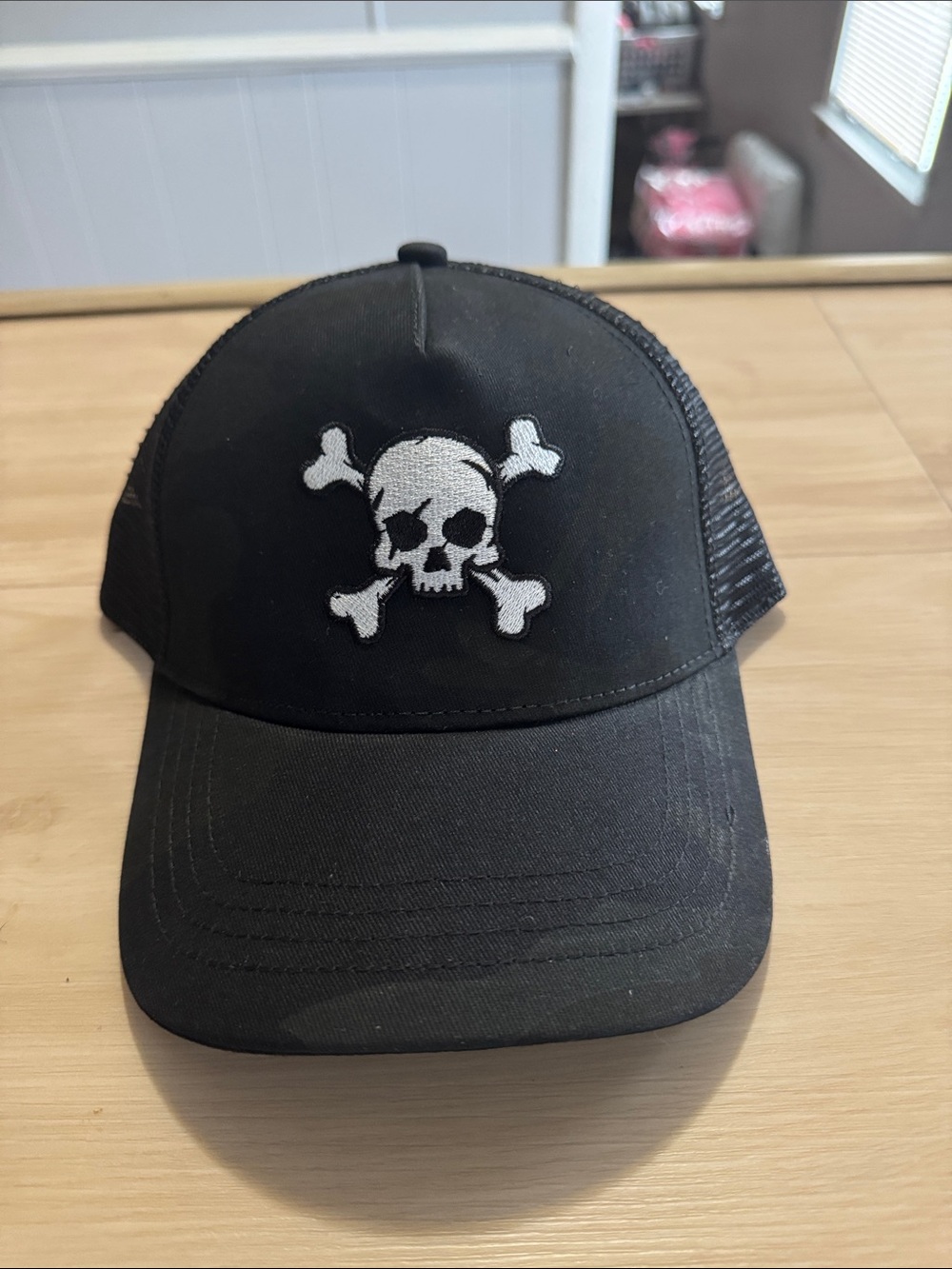 24/7 Life Black Camo Trucker Hat with White Skull & Crossbones Patch